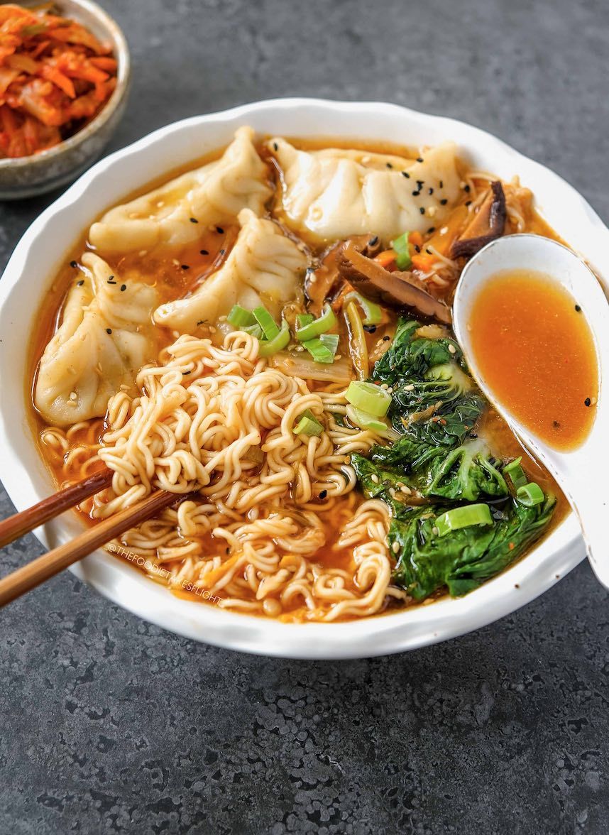 Dumpling and ramen noodle soup in a spiced broth