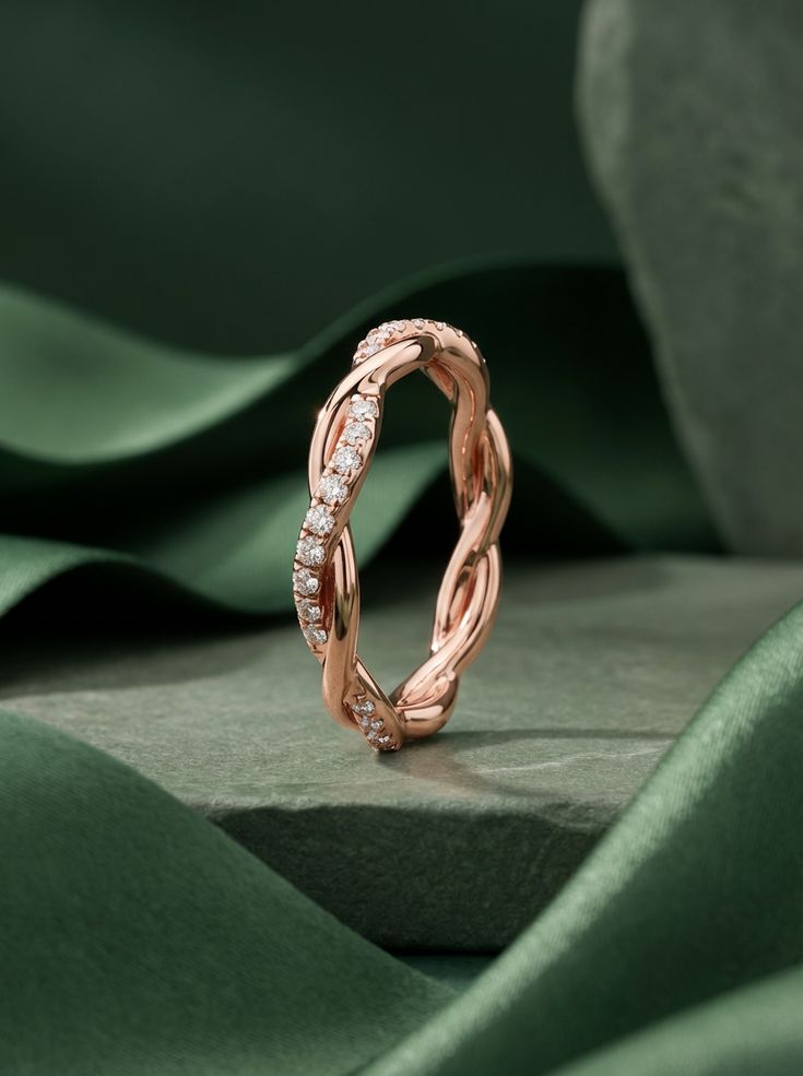 Rose gold diamond band on green silk